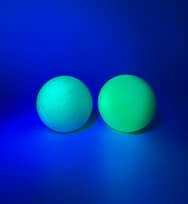 green glow golf ball left, yellow right
