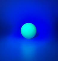green glow golf ball under UV light
