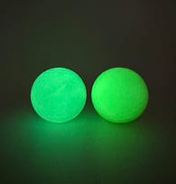 green glow golf ball left, yellow right
