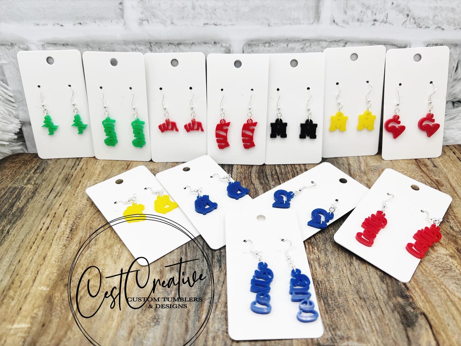 Different team earrings in acrylic